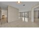 Bright living room features tile floors and large windows allowing natural light at 15628 Hidden Lake Cir, Clermont, FL 34711