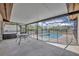 Screened-in patio area with a pool, perfect for outdoor entertaining at 15628 Hidden Lake Cir, Clermont, FL 34711