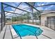 Screened pool with ample space for lounging and fenced perimeter at 15628 Hidden Lake Cir, Clermont, FL 34711