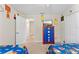 Playful ' bedroom with twin beds, colorful decor, and an entertainment center at 1596 Moon Valley Dr, Davenport, FL 33896