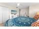 Bright bedroom with closet, television, dresser, and ensuite bathroom and study at 1596 Moon Valley Dr, Davenport, FL 33896