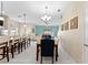 Open-concept dining area flowing into the kitchen and living space, perfect for modern living and entertaining at 1596 Moon Valley Dr, Davenport, FL 33896