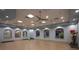 Bright exercise room features hardwood floors, ample mirrors, and exercise equipment at 1596 Moon Valley Dr, Davenport, FL 33896
