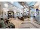 Bright, open lobby with stylish decor, multiple seating areas, and elegant light fixtures at 1596 Moon Valley Dr, Davenport, FL 33896