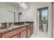 Bathroom featuring double sinks, granite counters, and direct access to toilet area at 17084 Harbor Oak Pkwy, Winter Garden, FL 34787