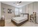 Nicely decorated bedroom with a neutral color scheme, ceiling fan, and natural light at 17084 Harbor Oak Pkwy, Winter Garden, FL 34787