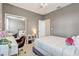 Bedroom with a bed, desk, and sliding closet with mirrorred doors at 17084 Harbor Oak Pkwy, Winter Garden, FL 34787