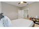 Bedroom showcasing a ceiling fan, closet, and soothing neutral tones at 17084 Harbor Oak Pkwy, Winter Garden, FL 34787