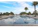 Serene community pool surrounded by palm trees, providing a relaxing outdoor experience at 17084 Harbor Oak Pkwy, Winter Garden, FL 34787