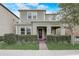Charming two-story home with a welcoming front porch and well-manicured landscaping at 17084 Harbor Oak Pkwy, Winter Garden, FL 34787