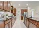Well-equipped kitchen with ample cabinet space, granite countertops, and stainless steel appliances at 17084 Harbor Oak Pkwy, Winter Garden, FL 34787