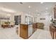 Spacious kitchen island adjoining the dining and living areas, great for entertaining guests at 17084 Harbor Oak Pkwy, Winter Garden, FL 34787