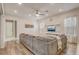 Comfortable living room with a large sofa, modern decor, and plenty of natural light at 17084 Harbor Oak Pkwy, Winter Garden, FL 34787