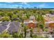 A high angle view of a multi-Gathering and single Gathering neighborhood, featuring mature trees and downtown in the distance at 1745 Indiana Ave # J, Winter Park, FL 32789