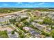 Expansive aerial view showcasing a neighborhood with mature trees and a variety of home styles, near downtown amenities at 1745 Indiana Ave # J, Winter Park, FL 32789