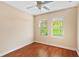 Bright bedroom with wood floors, a ceiling fan, and windows offering lots of natural light at 1745 Indiana Ave # J, Winter Park, FL 32789