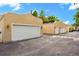 Property featuring multiple car garages and a paved driveway in a well-maintained community at 1745 Indiana Ave # J, Winter Park, FL 32789
