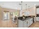 Bright kitchen featuring a counter with seating, stainless appliances, and an adjacent dining area at 1745 Indiana Ave # J, Winter Park, FL 32789