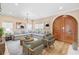Bright living room featuring hardwood floors, comfortable seating, and a stylish round coffee table at 1745 Indiana Ave # J, Winter Park, FL 32789