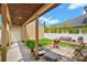 Charming covered patio with outdoor seating and grill, perfect for entertaining guests at 1745 Indiana Ave # J, Winter Park, FL 32789