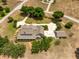 Expansive estate aerial showcasing lush landscaping, long driveway, and a meticulously maintained home exterior at 17631 Vista Belle Ct, Montverde, FL 34756