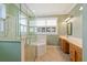 Bathroom featuring a glass shower and separate soaking tub at 17631 Vista Belle Ct, Montverde, FL 34756