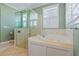 Bright bathroom with large soaking tub and walk-in shower at 17631 Vista Belle Ct, Montverde, FL 34756