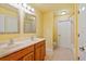 Bathroom featuring dual sinks, a walk-in shower, and tile flooring at 17631 Vista Belle Ct, Montverde, FL 34756