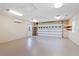 Spacious garage interior features smooth flooring, bright lighting and ample space at 17631 Vista Belle Ct, Montverde, FL 34756