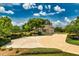 Detached garage with lush landscaping and a circular driveway at 17631 Vista Belle Ct, Montverde, FL 34756