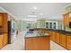 Spacious kitchen with granite countertops, stainless steel appliances, and a center island at 17631 Vista Belle Ct, Montverde, FL 34756
