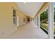 Spacious covered patio offers tiled floors, ceiling fans, and beautiful outdoor views at 17631 Vista Belle Ct, Montverde, FL 34756