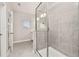 Light and bright bathroom featuring a glass enclosed shower, neutral paint, and tile floors at 1915 Terrapin Rd, Ocoee, FL 34761