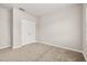 Cozy bedroom featuring plush carpeting and a double-door closet at 1915 Terrapin Rd, Ocoee, FL 34761