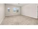 A neutral-colored bedroom with three windows providing natural light at 1915 Terrapin Rd, Ocoee, FL 34761