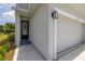 Exterior view of the home's entrance and attached one-car garage at 1915 Terrapin Rd, Ocoee, FL 34761