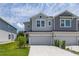 Attractive two-story townhouse featuring a one-car garage and a concrete driveway at 1915 Terrapin Rd, Ocoee, FL 34761