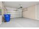 Spacious garage with epoxy flooring and an automatic door system, providing durable and convenient vehicle storage at 1915 Terrapin Rd, Ocoee, FL 34761