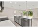 Spacious kitchen boasts white countertops, stainless steel appliances, and a large island with sink at 1915 Terrapin Rd, Ocoee, FL 34761