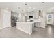 Open concept kitchen with pendant lighting and stainless steel refrigerator at 1915 Terrapin Rd, Ocoee, FL 34761