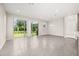 Bright living room with tile flooring, ample natural light, and access to the backyard at 1915 Terrapin Rd, Ocoee, FL 34761
