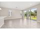 Bright living room featuring tile floors, recessed lighting, and sliding glass doors to the backyard at 1915 Terrapin Rd, Ocoee, FL 34761