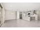 Open concept floor plan with tile floors connecting the kitchen, living, and dining areas at 1915 Terrapin Rd, Ocoee, FL 34761