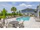Community pool with lounge chairs and tables for relaxing by the pool at 1915 Terrapin Rd, Ocoee, FL 34761