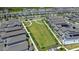 This aerial captures the community green space, sidewalks, and the surrounding residential area at 2388 Volunteer Ave, Kissimmee, FL 34744