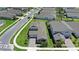 An aerial view of the house showcasing its landscaping, driveway, and neighborhood surroundings at 2388 Volunteer Ave, Kissimmee, FL 34744