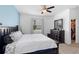 Bedroom with a large bed, dresser, and a walk-in closet providing storage and functionality at 2388 Volunteer Ave, Kissimmee, FL 34744