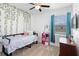 Cozy bedroom with green vines decoration, providing a tranquil and inviting space at 2388 Volunteer Ave, Kissimmee, FL 34744