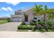 Charming two-story home with a paved driveway, landscaped yard and welcoming front porch at 2388 Volunteer Ave, Kissimmee, FL 34744