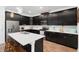 Spacious kitchen with stainless steel appliances, a large center island, and modern pendant lighting at 2388 Volunteer Ave, Kissimmee, FL 34744